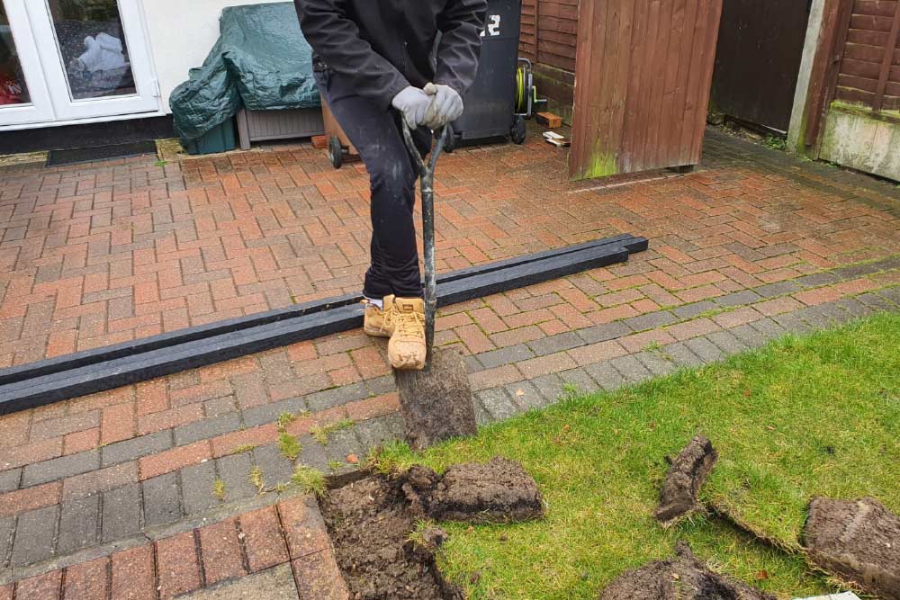 New Lawn staff digging up old grass