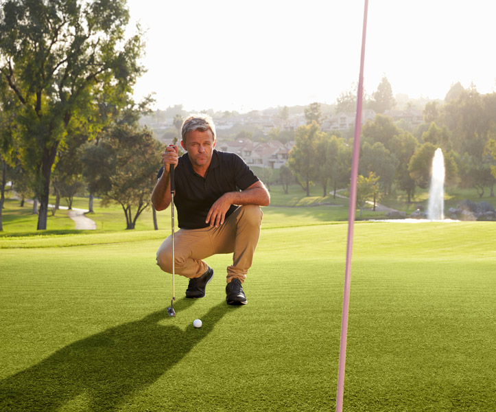 Man standing on Pro Put Artificial Grass golf course
